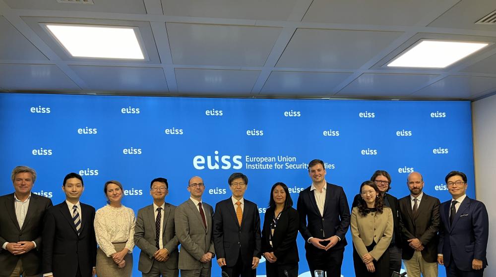 Image of event participants stood together for a photo © EUISS